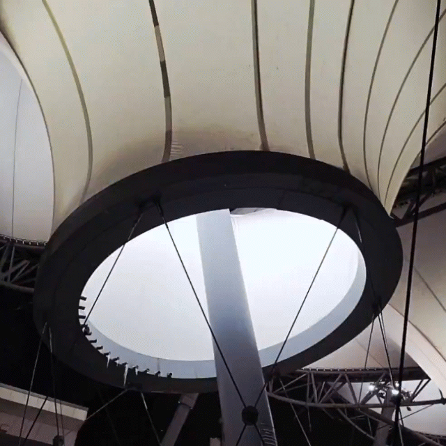 Looking straight up into the canopy and oculus of the Rosa Parks Transit Center