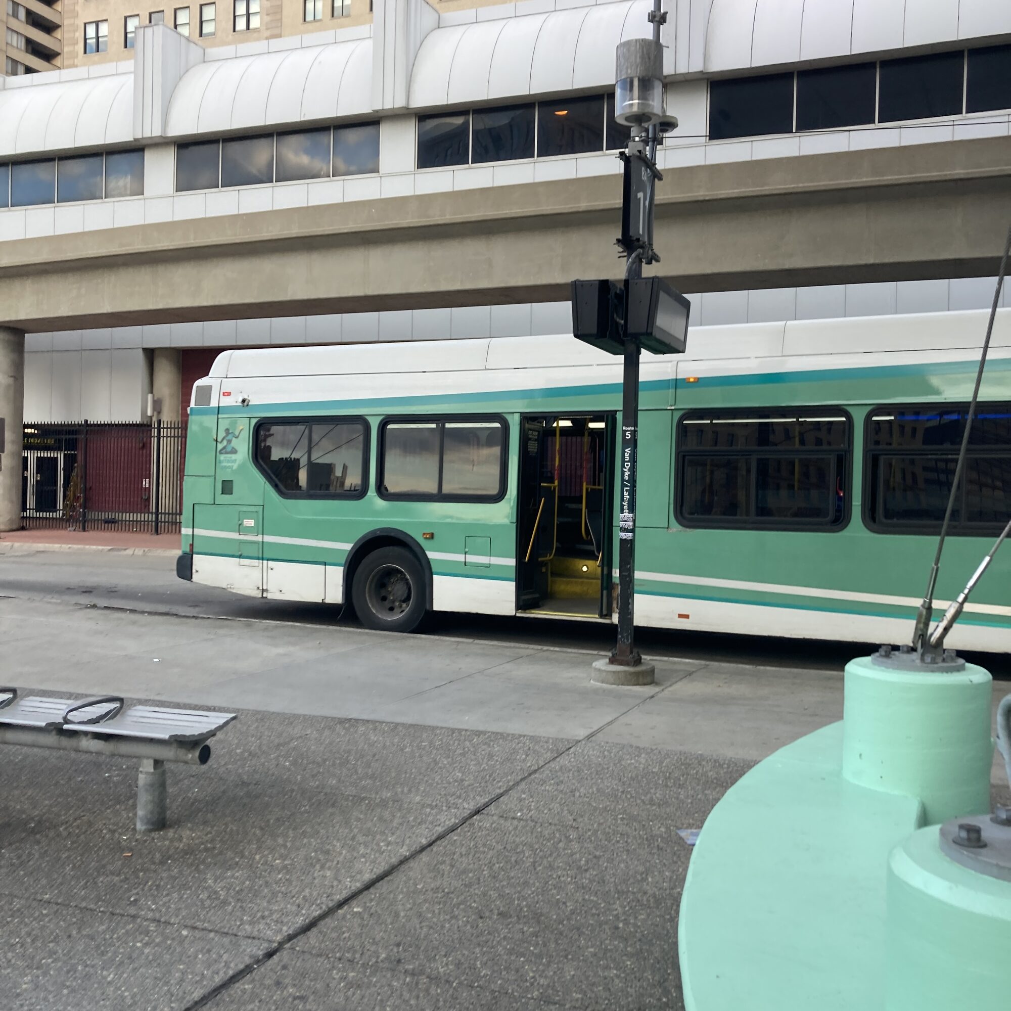 DDOT bus stopped at a downtown Detroit curb with its doors open